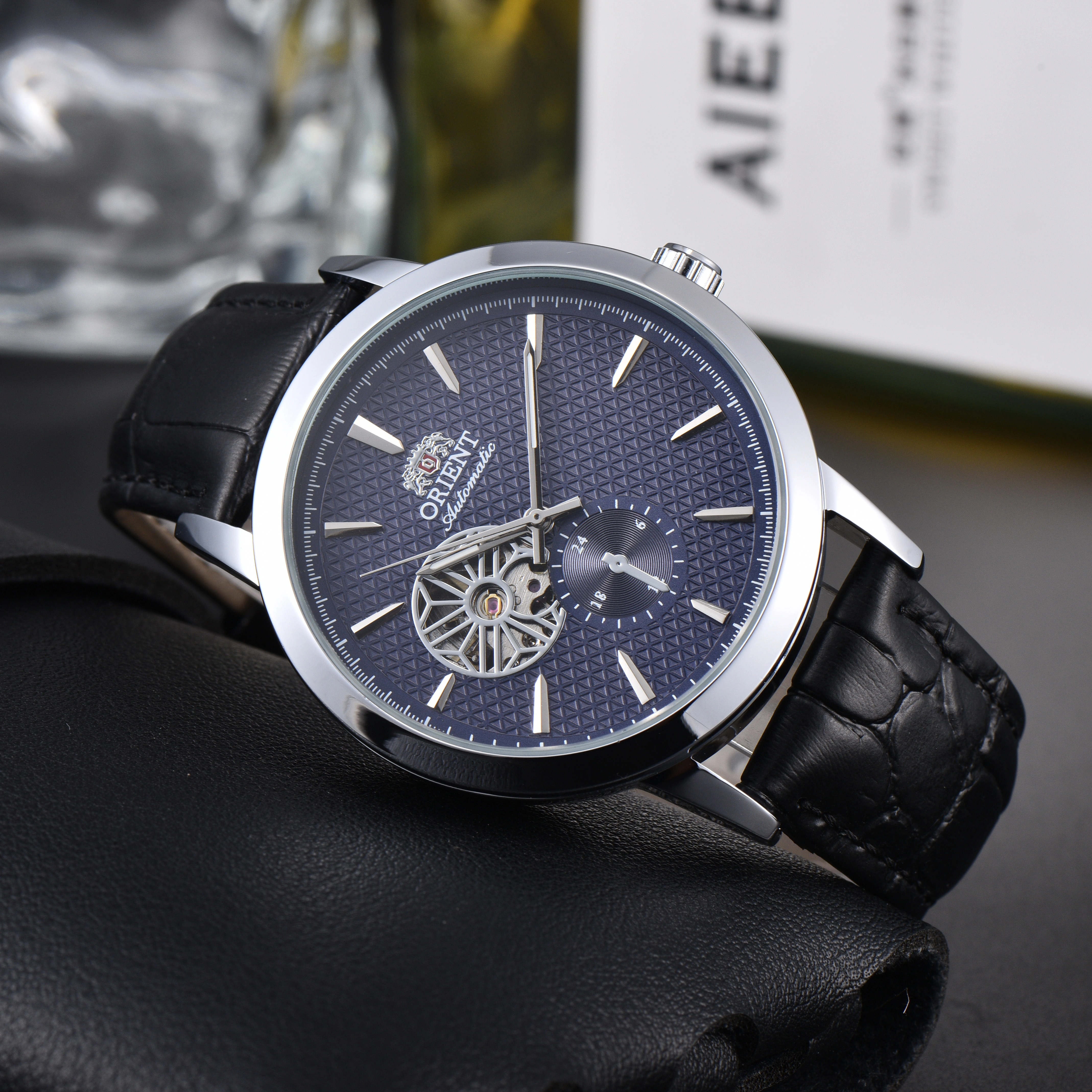 Montre squelette mécanique DFDG Orient : Fonctionnalités complètes, heure mondiale, design minimalis