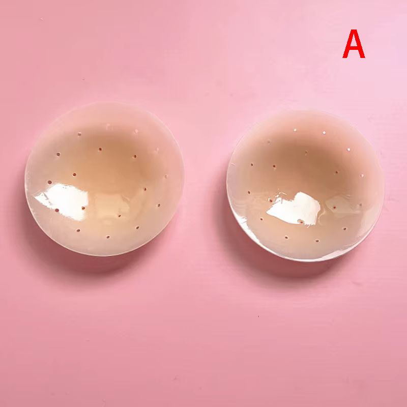 1 paire de patchs mammaires en silicone perforés, respirants, anti-choc et anti-transparence.