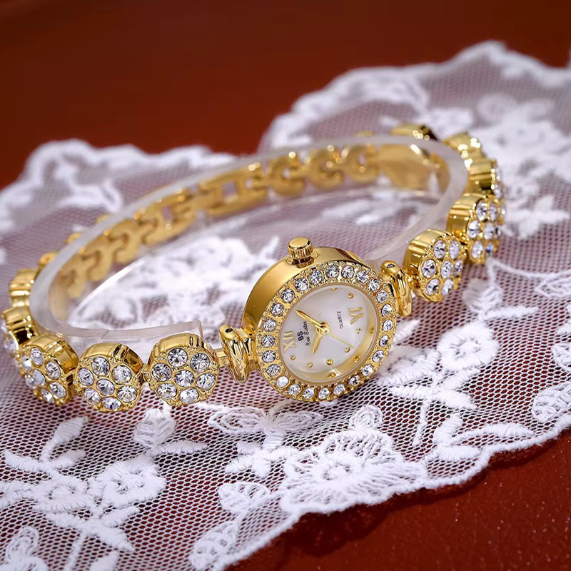 Montres-bracelets de luxe pour femmes, marque supérieure, quartz doré, or, biscuits uniques, bracelet en acier, cadeau pour dames, 2025