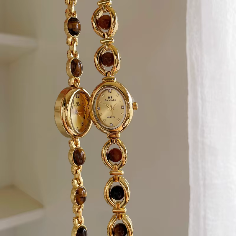 [Ambre] montre-bracelet ovale à petit cadran pour femmes rétro style national montre à quartz pour femme marée véritable