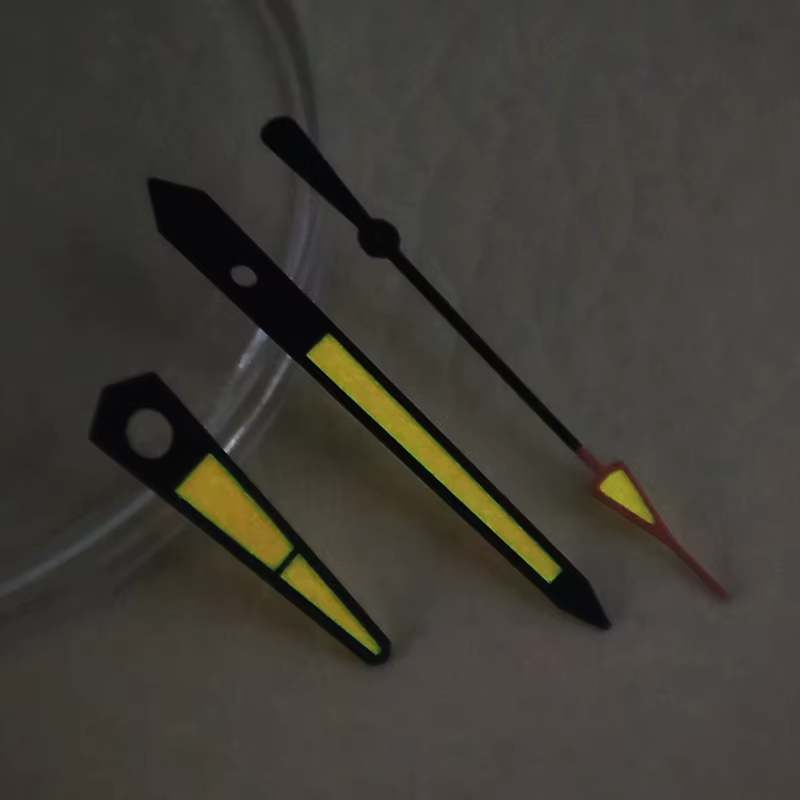 Aiguilles de montre lumineuses bicolores orange et rose