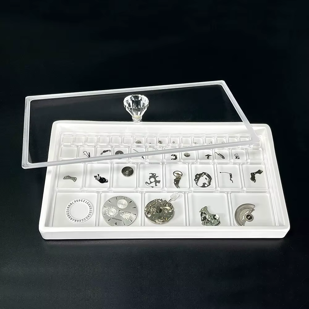 Couverture transparente pour le stockage des pièces de montre