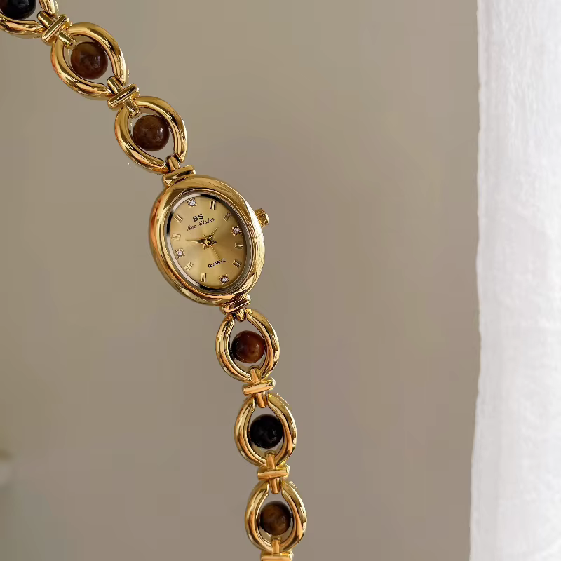 [Ambre] montre-bracelet ovale à petit cadran pour femmes rétro style national montre à quartz pour femme marée véritable